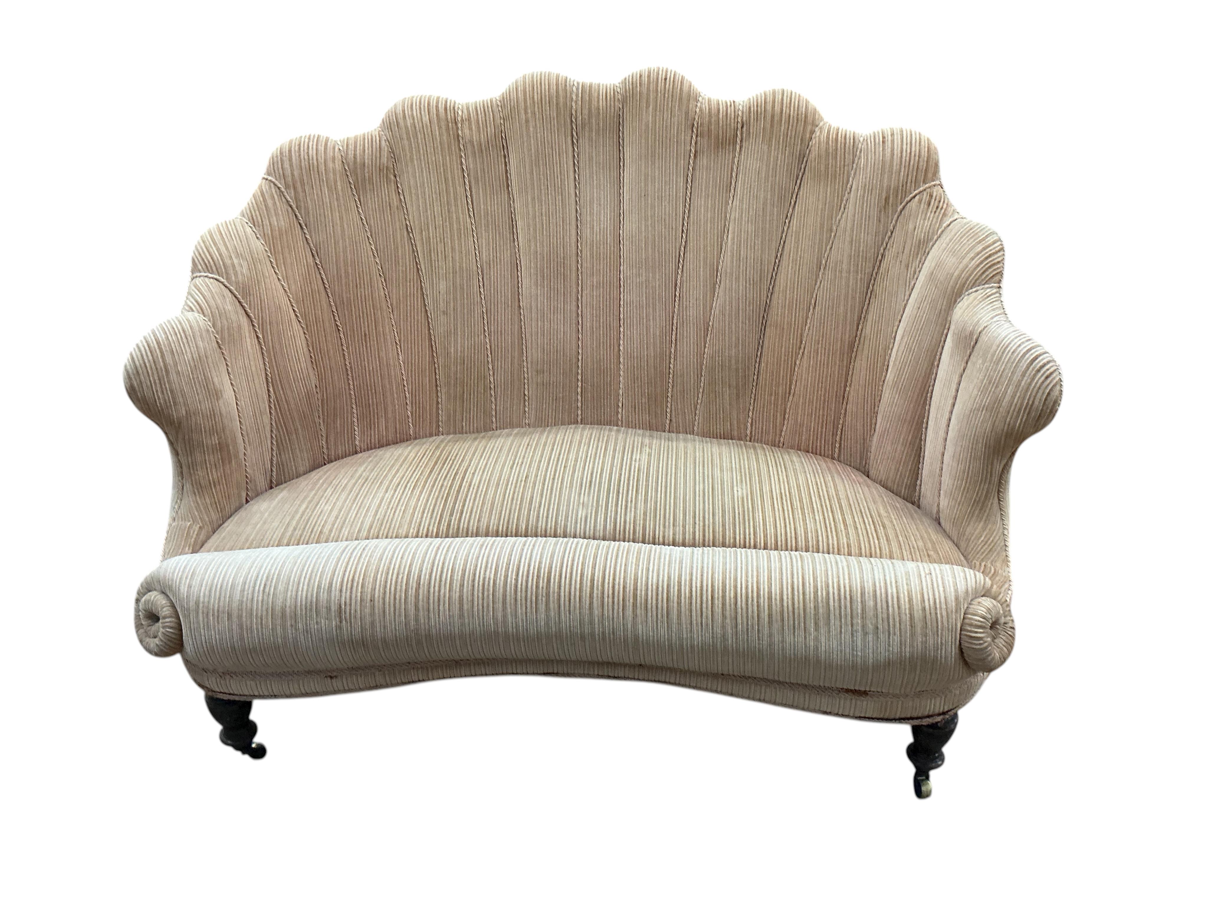 A Victorian upholstered scallop shell two seater settee on turned tapered feet, width 130cm, depth 70cm, height 85cm